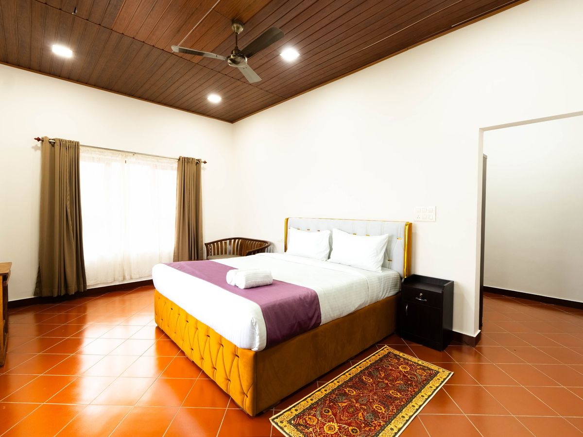 Premium Room with king bed and wooden ceiling at Zen Garden Vagamon