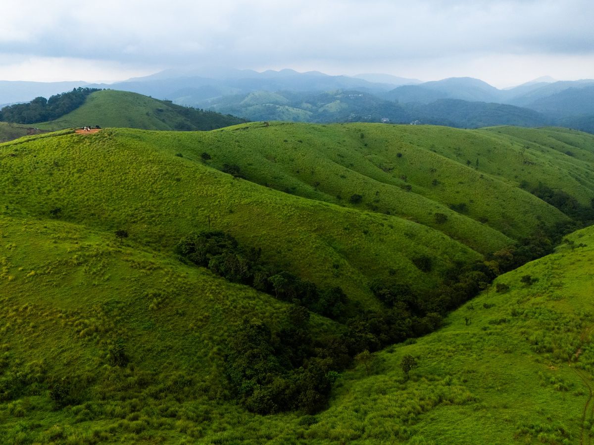 Green meadows and ridges of Vagamon seen from above